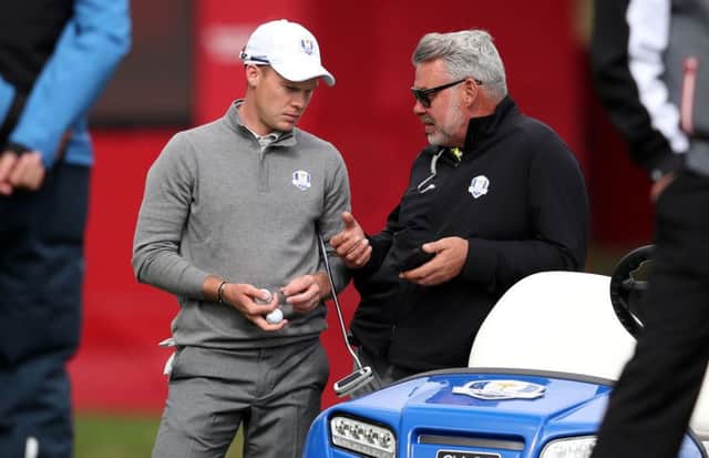 European captain Darren Clarke chats to Danny Willett about his brother's comments. Picture: Getty Images