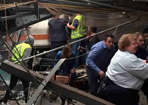 Passengers rush to safety after a NJ Transit train crashed in to the platform at the Hoboken Terminal.
Picture: Getty Images