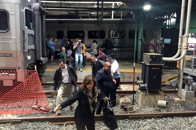 Passengers rush to safety after the train crashed in to the platform at the Hoboken Terminal. Picture: Getty Images