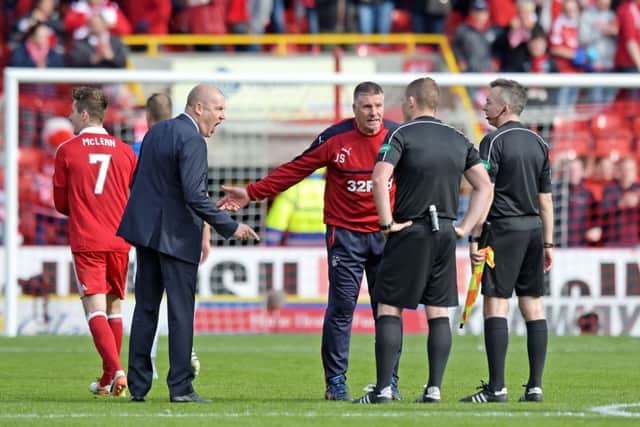 Mark Warburton remonstrates with referee John Beaton at full time. Picture: SNS