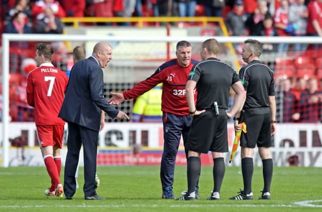 Mark Warburton remonstrates with referee John Beaton at full time. Picture: SNS