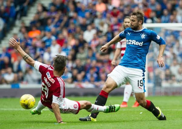 Niko Kranjcar, right, has been shocked by the level of media scrutiny Rangers are subjected to, says Mark Warburton. Picture: John Devlin