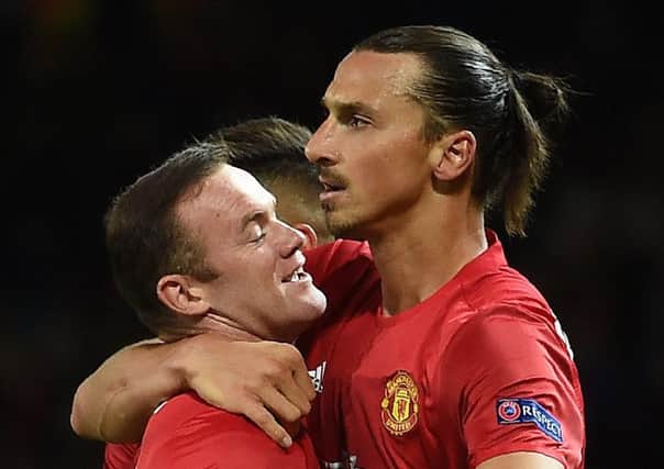 Manchester United's Swedish striker Zlatan Ibrahimovic celebrates scoring his team's winner with Wayne Rooney. Picture: AFP/Getty Images