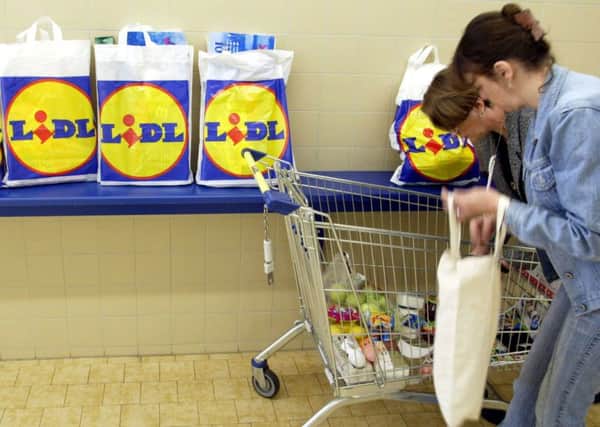 Lidl has said it will remove single-use plastic bags from its UK stores by July next year