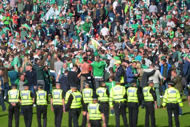 The aftermath of the Scottish Cup final was marred by a pitch invasion. Picture: Craig Williamson/SNS