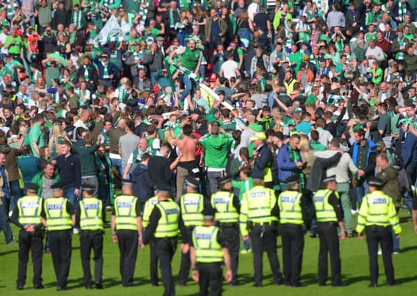 The aftermath of the Scottish Cup final was marred by a pitch invasion. Picture: Craig Williamson/SNS