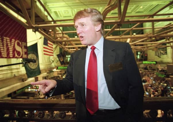 Trump's business losses in 1995 were so large that they could have allowed him to avoid paying federal income taxes for as many as 18 years, according to records obtained by The New York Times.  (AP Photo/Kathy Willens, File)