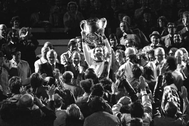 Accidental hero: Franz Beckenbauer, also a fan of Easter Road, lifts the European Cup at Hampden in 1976. Photograph: SNS