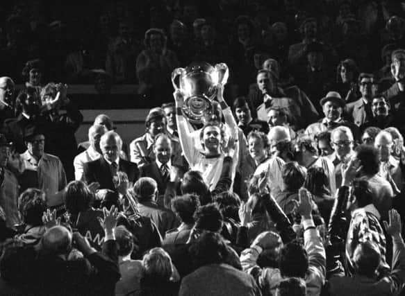 Accidental hero: Franz Beckenbauer, also a fan of Easter Road, lifts the European Cup at Hampden in 1976. Photograph: SNS