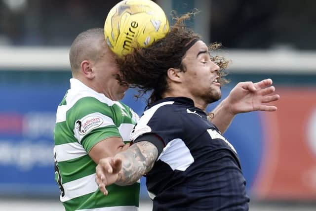 Celtic's Scott Brown battles for the ball with Dundee's Yordi Teijsse. Picture: Rob Casey/SNS