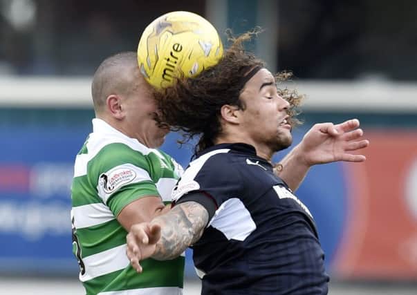 Celtic's Scott Brown battles for the ball with Dundee's Yordi Teijsse. Picture: Rob Casey/SNS