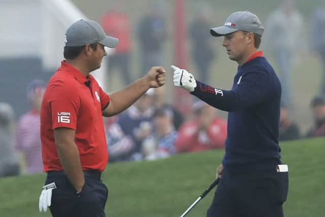 Patrick Reed fist pumps USA team-mate Jordan Spieth during their foursomes victory against Justin Rose and Henrik Stenson at Hazeltine. Picture: AP Photo/David J. Phillip