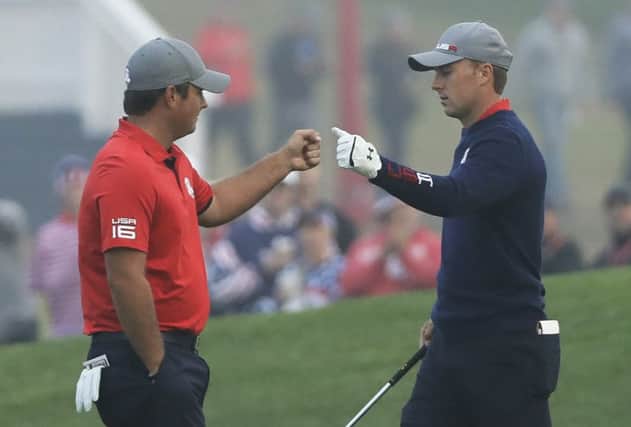 Patrick Reed fist pumps USA team-mate Jordan Spieth during their foursomes victory against Justin Rose and Henrik Stenson at Hazeltine. Picture: AP Photo/David J. Phillip