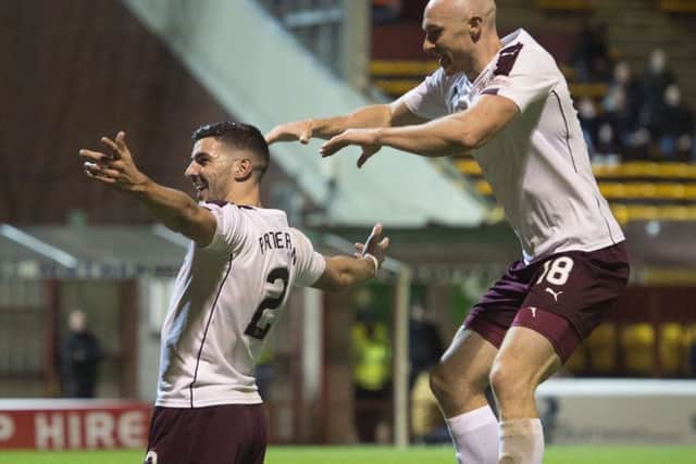 Callum Paterson, left, celebrates scoring Hearts' second goal with team-mate Conor Sammon. Picture: SNS.