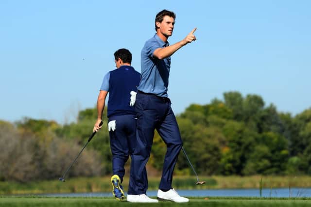 Thomas Pieters gestures to the crowd on his way to victory with Rory McIlroy at Hazeltine. Picture: Getty Images