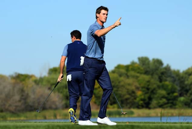 Thomas Pieters gestures to the crowd on his way to victory with Rory McIlroy at Hazeltine. Picture: Getty Images