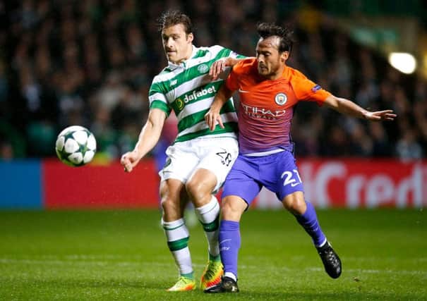 Manchester City's David Silva (right) and Celtic's Erik Sviatchenko battle for the ball during the UEFA Champions League, Group C match at Celtic Park, Glasgow. PRESS ASSOCIATION Photo. Picture date: Wednesday September 28, 2016. See PA story SOCCER Man City. Photo credit should read: Jane Barlow/PA Wire