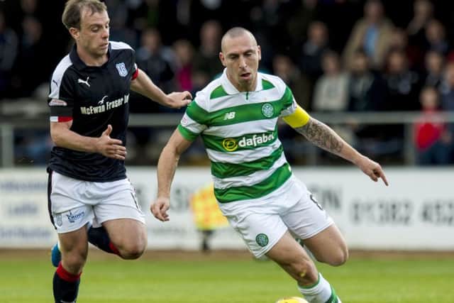 Celtic's Scott Brown (right) scored the only goal of the match at Dens Park. Picture: SNS