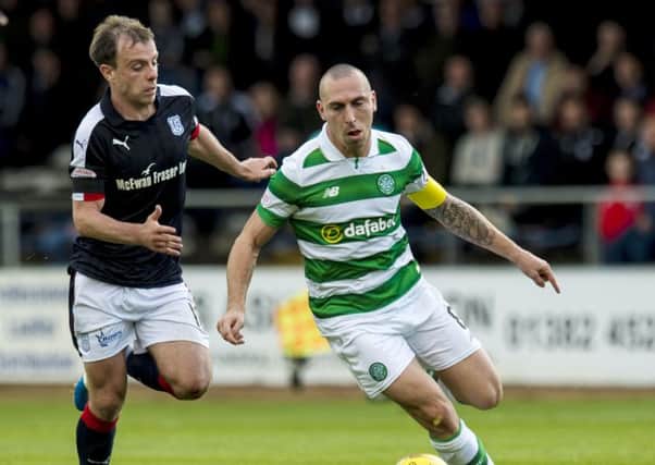 Celtic's Scott Brown (right) scored the only goal of the match at Dens Park. Picture: SNS