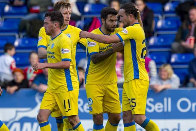 St Johnstone's Christopher Kane (right) celebrates his goal with team mates after being set up by Danny Swanson (left). Picture: SNS