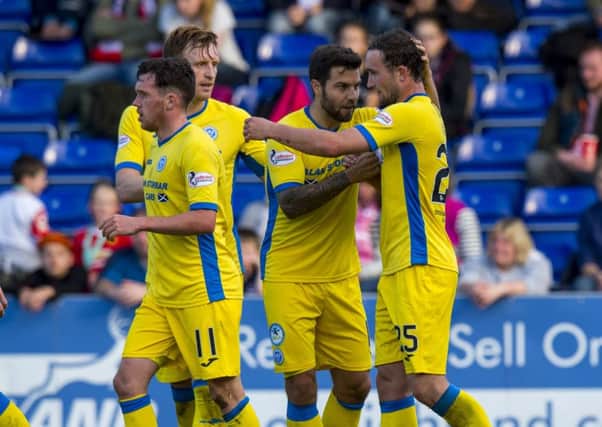 St Johnstone's Christopher Kane (right) celebrates his goal with team mates after being set up by Danny Swanson (left). Picture: SNS