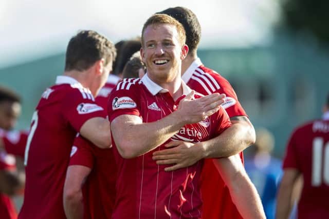 Aberdeen's Adam Rooney celebrates scoring the fourth goal of the match. Picture: SNS