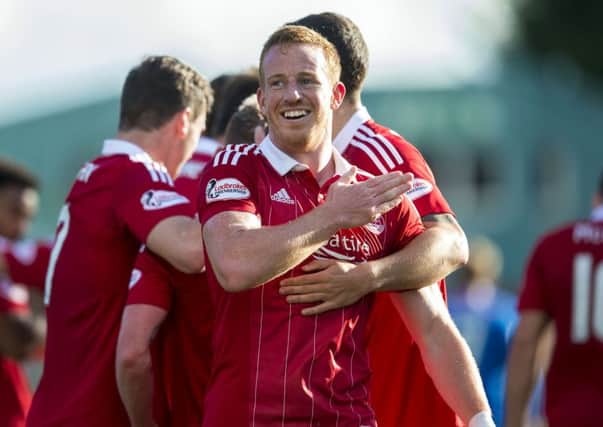 Aberdeen's Adam Rooney celebrates scoring the fourth goal of the match. Picture: SNS