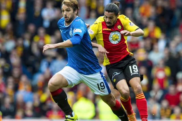 Rangers' Niko Kranjcar (left), who scored his side's opening goal, tussles with Ryan Edwards. PictureL SNS