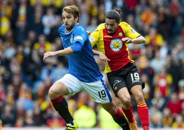 Rangers' Niko Kranjcar (left), who scored his side's opening goal, tussles with Ryan Edwards. PictureL SNS