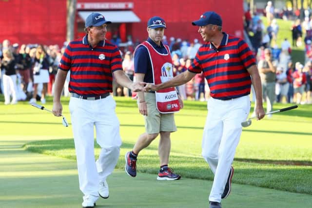 CHASKA, MN - OCTOBER 01:  Phil Mickelson and Matt Kuchar of the United States reacts after a putt by Kuchar on the 13th green during afternoon fourball matches of the 2016 Ryder Cup at Hazeltine National Golf Club on October 1, 2016 in Chaska, Minnesota.  (Photo by Andrew Redington/Getty Images)