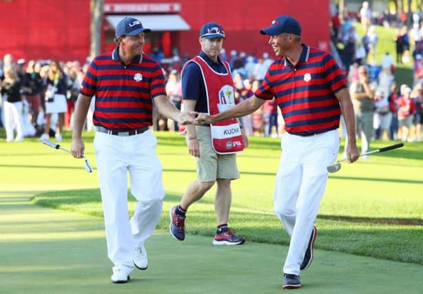 CHASKA, MN - OCTOBER 01:  Phil Mickelson and Matt Kuchar of the United States reacts after a putt by Kuchar on the 13th green during afternoon fourball matches of the 2016 Ryder Cup at Hazeltine National Golf Club on October 1, 2016 in Chaska, Minnesota.  (Photo by Andrew Redington/Getty Images)