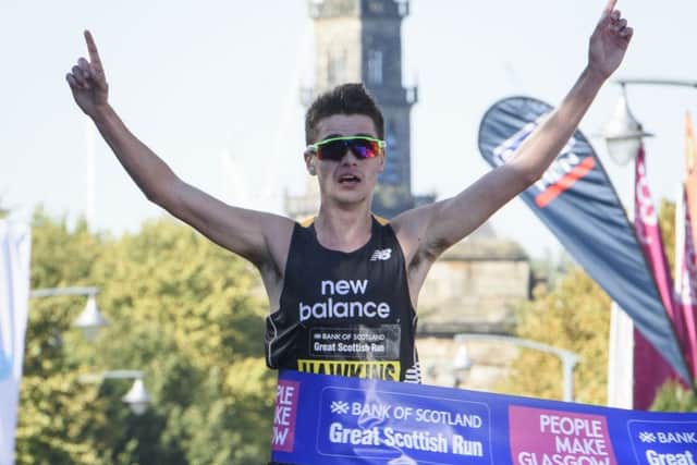 Scottish runner Callum Hawkins crosses the finishing line to win the Elite Half Marathon race at the Great Scottish Run in Glasgow. Picture: John Linton/PA Wire
