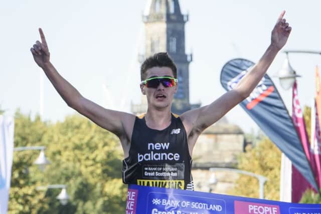 Callum Hawkins crosses the line to win the elite half marathon at the Great Scottish Run in Glasgow. Picture: John Linton/PA Wire
