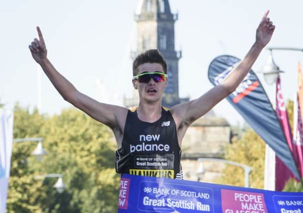 Callum Hawkins crosses the line to win the elite half marathon at the Great Scottish Run in Glasgow. Picture: John Linton/PA Wire