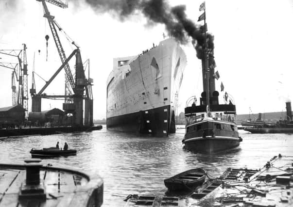 The launching of the liner the Queen Mary from the river Clyde in September 1934.