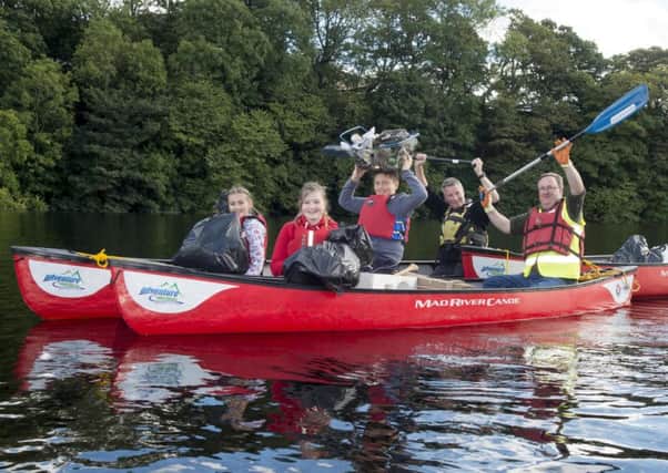 The clean-up team collecting litter on the River Dee. Picture: Contributed