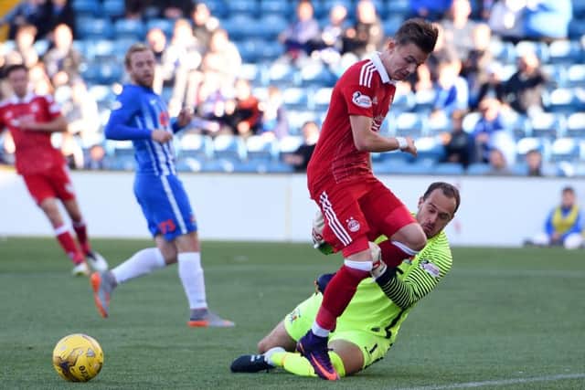 Kilmarnock goalkeeper Jamie MacDonald takes down Aberdeen's James Maddison to concede a penalty. Picture: SNS