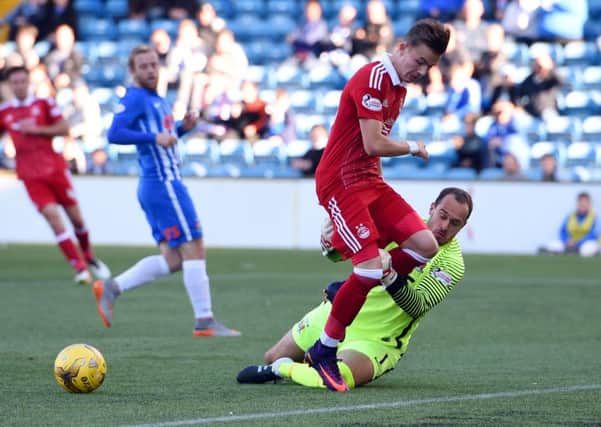 Kilmarnock goalkeeper Jamie MacDonald takes down Aberdeen's James Maddison to concede a penalty. Picture: SNS