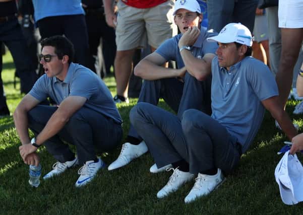 European trio, from left, Rory McIlroy, Thomas Pieters and Rafael Cabrera-Bello cut dejected figures after the defeat.