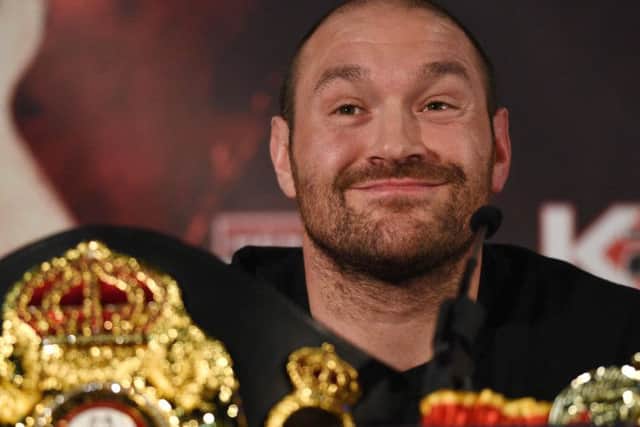 (FILES) This file photo taken on April 27, 2016 shows British heavyweight boxer Tyson Fury reacts during a press conference to publicise his forthcoming world heavyweight title fight against Ukranian heavyweight Wladimir Klitschko, at the Manchester Arena in Manchester, north-west England. Controversial world heavyweight champion Tyson Fury made an abrupt U-turn on his retirement decision on October 3, 2016, tweeting: "I'm here to stay." "Hahahaha u think you will get rid of the GYPSYKING that easy!!! I'm here to stay," Fury wrote on Twitter.he provocative 28-year-old British brawler, dogged by reports he failed a drugs test for cocaine, had earlier declared himself "retired" in a profanity-strewn tweet. / AFP PHOTO / OLI SCARFFOLI SCARFF/AFP/Getty Images