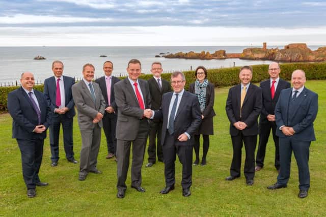 N C Campbell & Co partner Ewan Millar, on the left, shakes hands on the deal with Alan Patterson of Greaves West & Ayre. Picture: Contributed