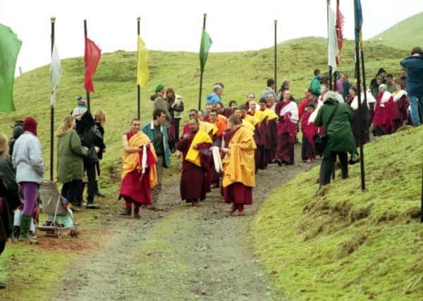 Men and women leaving the Samye-Ling Tibetan Centre at Eskdalemuir in Dumfriesshire, after spending four years inside the Buddhist retreat.