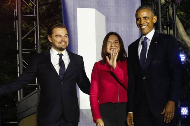 U.S President Barack Obama, Leonardo DiCaprio and Dr. Katharine Hayhoe arrive at a panel discussion  on climate chang. (Photo by Aude Guerrucci-Pool/Getty Images)
