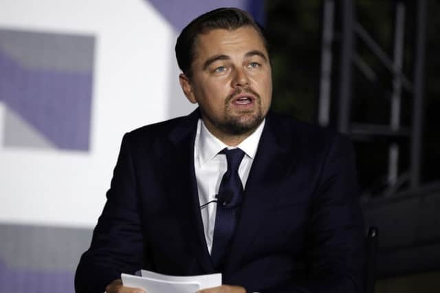 Actor Leonardo DiCaprio, joined by U.S. President Barack Obama and Katharine Hayhoe, speaks about climate change as part of the White House South by South Lawn event on the South Lawn of the White House in Washington. 2016. (AP Photo/Carolyn Kaster)