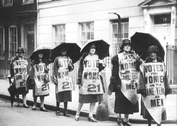 Suffragettes marching for the right for women to vote.