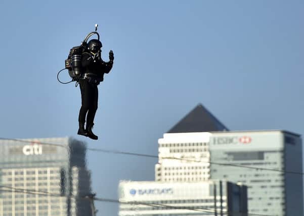David Mayman pilots the JB-10 Jetpack flying machine over the Royal Victoria Docks. Picture: PA