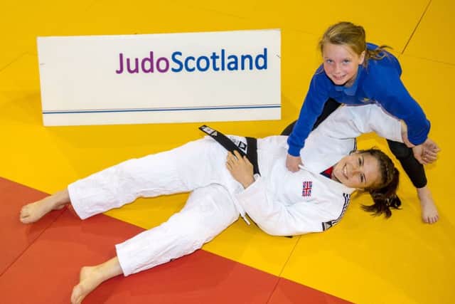 Malin Wilson joins pupil Alexis Faulds from Dalmarnock Primary School to launch the European Judo Open. Picture: Alan Harvey/SNS
