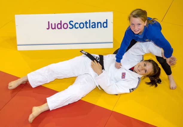 Malin Wilson joins pupil Alexis Faulds from Dalmarnock Primary School to launch the European Judo Open. Picture: Alan Harvey/SNS
