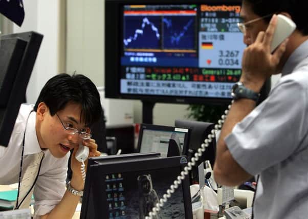 Market-watchers pointed to a 'rogue algorithm' as the pound slumped overnight. Picture: Katsumi Kasahara/AP