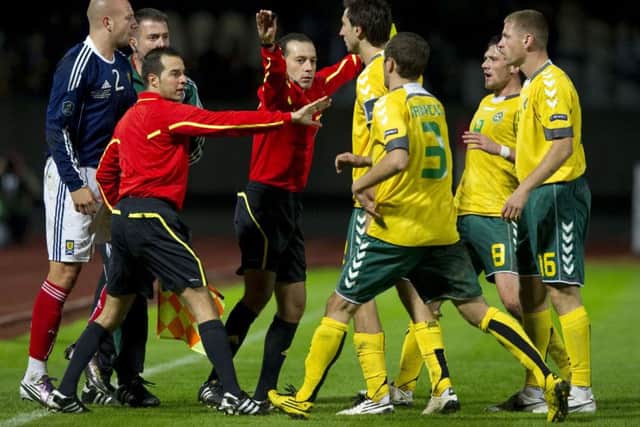 A clash between four Lithuanian internationals, including ex-Hearts winger Kestutis Ivaskevicius (right), and Alan Hutton in 2010. Picture: SNS